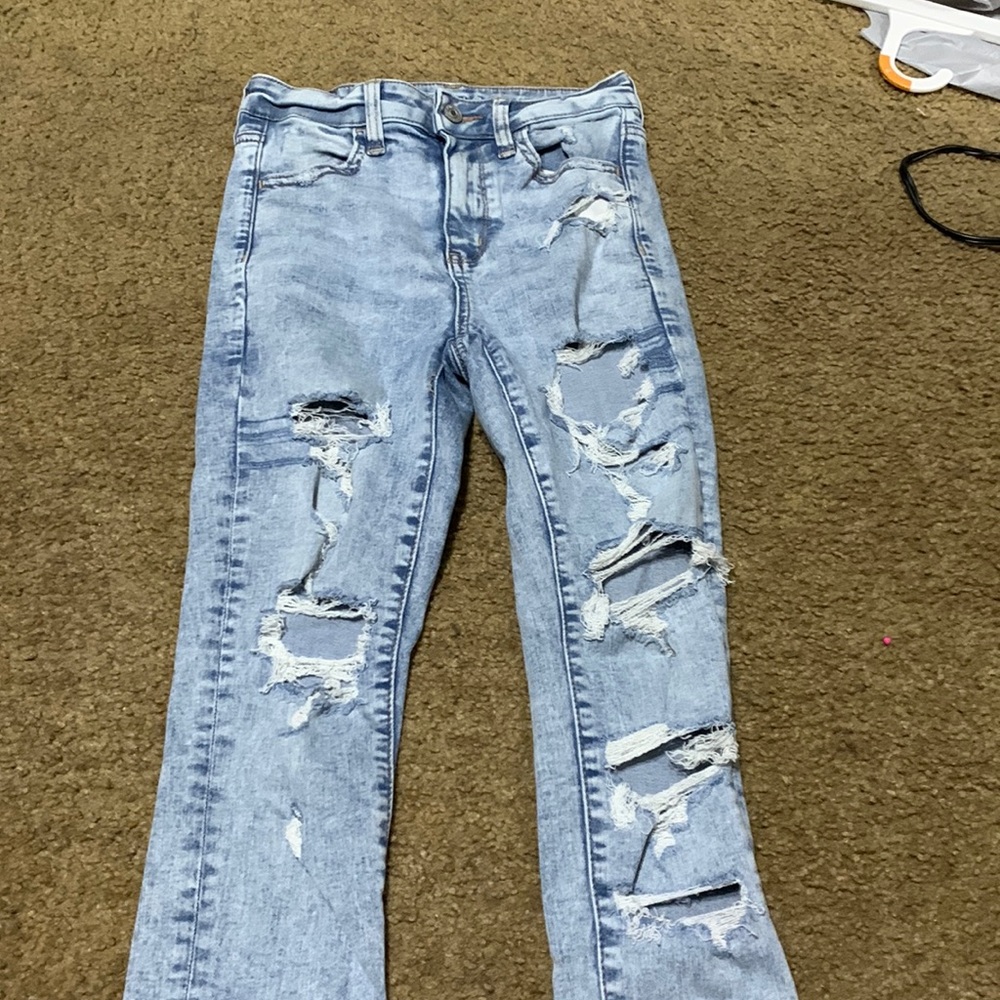 AE ripped blue jeans